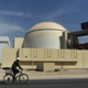 In this Oct. 26, 2010, file photo, a worker rides a bike in front of the reactor building of the Bushehr nuclear power plant, just outside the southern city of Bushehr, Iran. (Majid Asgaripour, File/AP Images/Mehr News Agency)